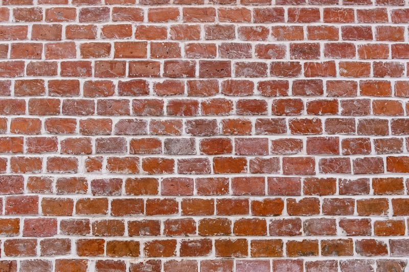 Brick Vs. Stone Tuckpointing: Key Differences For Commercial Projects